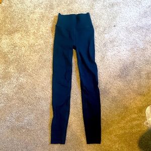 These are small form fitting black leggings by SculpKnit made by Fabletics.